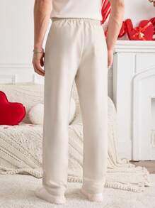 Manfinity VCAY Manfinity ModaGents 男士梭织刺绣图案修身长款直筒休闲裤，适合日常穿着、情侣装、情人节礼物。 - 杏色 - 查看 5