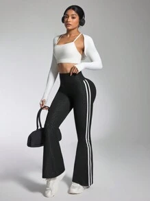 Damskie spodnie fitness z rozszerzanymi nogawkami i paskami po bokach, codzienne, aktywne