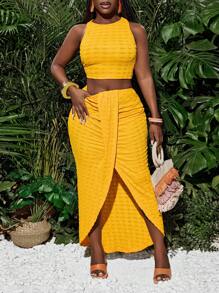 Slaydiva Nieuwe lente en zomer casual vakantie ronde hals mouwloos cropped vest + midden voorkant overlappende geplooide hoge split tot dij boog zoom asymmetrische zoom rok gele textuur stof dames tweedelige set