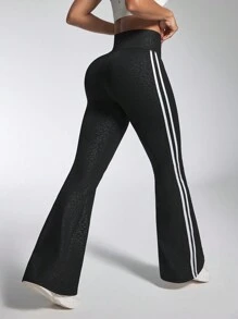 Damskie spodnie fitness z rozszerzanymi nogawkami i paskami po bokach, codzienne, aktywne