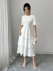 Elenzga Minimalistische effenkleurige jurk met strikversiering en taartzoom voor dames