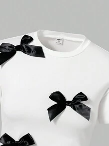 SHEIN 2pcs Tween Girl White Loose Short Sleeve T-Shirt & Black Bowknot + Black Flared Pants Outfit Set - White - View 6