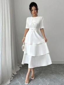 Elenzga Minimalistische effenkleurige jurk met strikversiering en taartzoom voor dames