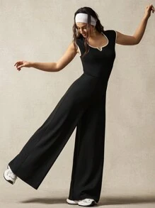 VARSITIE Kurze Ärmel, kontrastfarbiger Rand, ausgeschnittener Rücken, weite Beine, lockere Sport-Jumpsuits