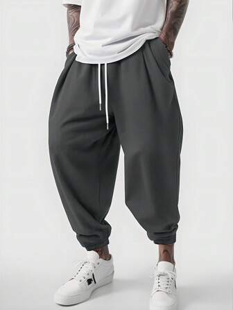 Manfinity Dauomo Pantalones casuales sueltos para hombre con cintura con cordón y dobladillo con banda, otoño