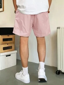 Manfinity Hypemode Pantalones cortos holgados para hombres con bolsillos en diagonal y cordón en la cintura