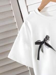 青少年女孩两件套服装，蕾丝蝴蝶结 T 恤上衣 + 复古格子裙套装，夏季度假和户外服装 - 黑與白 - 查看 4