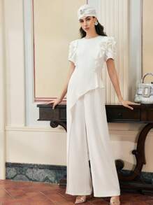 ZEYLAH MONO DE PERNERA ANCHA ASIMÉTRICO CON PUÑO VOLANTE