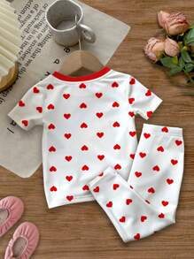 SHEIN Conjunto de 2 piezas de pijama informal para niña con estampado de lunares, corazones y diseños de dibujos animados, de manga corta, apropiado para primavera/verano