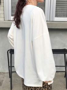 FRIFUL Camiseta básica larga de manga larga con cuello redondo, bajo dividido y corte oversize en color blanco, para primavera