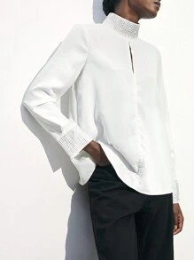 Maija بلوزة أنيقة بأكمام طويلة فضفاضة لحفلات المناسبات مزينة بالراين ستون والتقسيمات المفرغة في الياقة والأساور ، بتصميم أبيض مناسب لفصل الربيع المبكر / الربيع ، تصميم عملي وأنيق للحفلات الحضرية - أبيض - مشاهدة 3