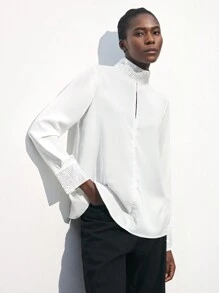 Maija بلوزة أنيقة بأكمام طويلة فضفاضة لحفلات المناسبات مزينة بالراين ستون والتقسيمات المفرغة في الياقة والأساور ، بتصميم أبيض مناسب لفصل الربيع المبكر / الربيع ، تصميم عملي وأنيق للحفلات الحضرية - أبيض - مشاهدة 1