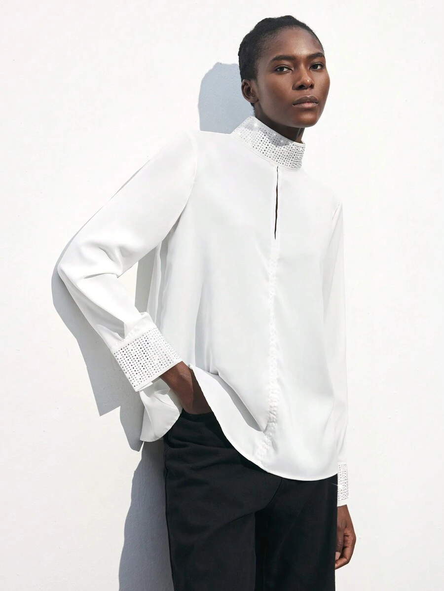 Maija بلوزة أنيقة بأكمام طويلة فضفاضة لحفلات المناسبات مزينة بالراين ستون والتقسيمات المفرغة في الياقة والأساور ، بتصميم أبيض مناسب لفصل الربيع المبكر / الربيع ، تصميم عملي وأنيق للحفلات الحضرية - أبيض - مشاهدة 1