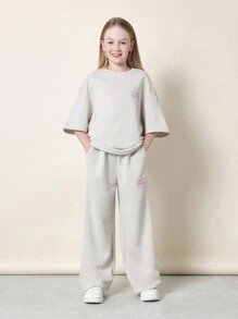 Conjunto de camiseta oversize y pantalón de chándal SUMWON Era-1 Streetwear de California, de dos piezas, cómodo, con texto rosa para relajarse, viajar y disfrutar de las vacaciones de manera informal - Albaricoque - Ver 2