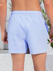 Manfinity Swimmode Shorts casuales de playa con bolsillo y atadura delantera a rayas para hombres
