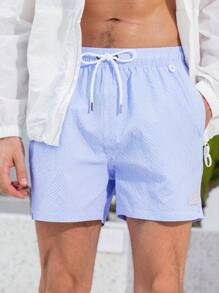 Manfinity Swimmode Shorts casuales de playa con bolsillo y atadura delantera a rayas para hombres
