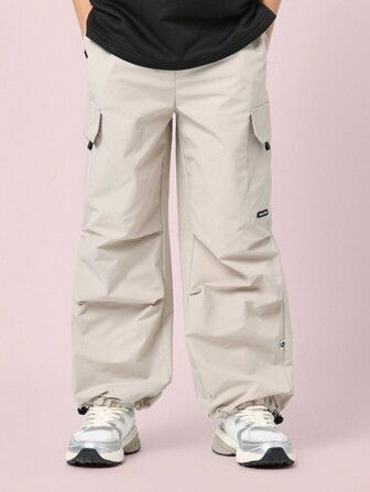 SUMWON Pantalones cargo para preadolescentes con tobillo elástico, deportes de invierno, nailon impermeable, aventura al aire libre, cintura ajustable, utilidad atlética con bolsillos laterales