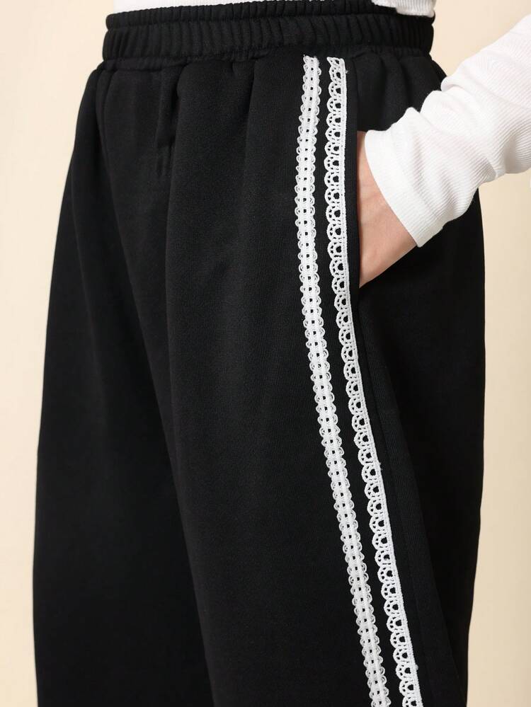Pantalon de survêtement confortable à jambes larges avec bordure en dentelle