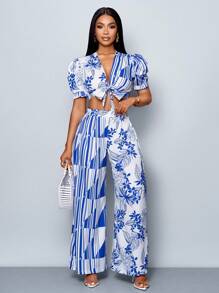 SOLERSUN Conjunto de 2 piezas de verano y primavera para mujer con blusa de manga abullonada, escote en V profundo con nudo al frente y pantalón recto plisado de cintura elástica, con estampado floral sobre fondo blanco, para paseos y vacaciones