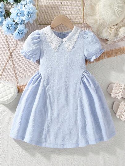 SHEIN Young Girls' Summer Fresh Light Blue Bubble Short Sleeve Dress, Paired With A White Lace Collar. The Dress Is Soft And Comfortable, Perfect For Summer Days. The Classic Light Blue Color Keeps You Looking Fresh And Bright, While The Bubble Short Sleeves Add A Playful And Cute Touch. The White Lace Collar Is Elegant Whether For Relaxing At Home, Gathering With Friends, Or Attending A Summer Party, It Is An Ideal Choice.