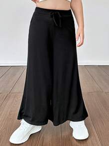 SHEIN Pantalones casuales sueltos y de un solo color de punto para niña