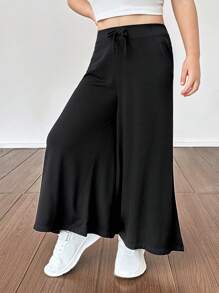 SHEIN Pantalones casuales sueltos y de un solo color de punto para niña