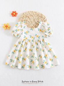 Cozy Pixies Babymeisjesjurk met pofmouwen en getailleerde taille en ditsy bloemenmotief