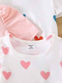 SHEIN Set de 4 piezas Blusa casual de bebé niña de unicolor con estampado de corazón y mangas abullonadas - Multicolor - Ver 7