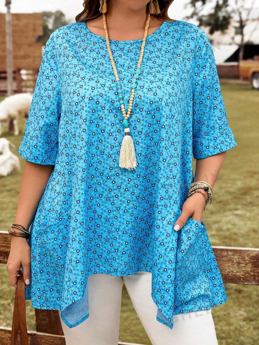 EMERY ROSE Camisa informal suelta de manga corta con cuello redondo, doble bolsillo y bajo asimétrico, con estampado floral azul tipo "ditsy" para mujer de talla grande, vestimenta occidental, atuendo de vacaciones apropiado para el verano