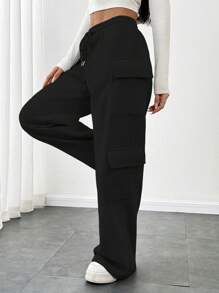 Flirla Pantalon gris décontracté pour femmes à taille basse, avec cordon de serrage, sangles, poches cargo et jambes larges. Un vêtement de sport minimaliste et pour l'automne.