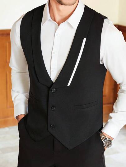 Manfinity Mode 男士商务正装，经典黑色西装马甲，尽显正式优雅风范。马甲前襟饰以不对称的白色撞色设计，更添时尚气息，彰显精致品味。无论是送给男友还是丈夫，都是绝佳之选。适合日常通勤、宴会及其他正式场合。男士舞会西装、男士婚礼西装