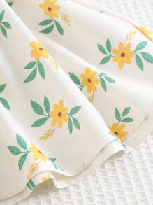 Cozy Pixies Babymeisjesjurk met pofmouwen en getailleerde taille en ditsy bloemenmotief