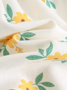 Cozy Pixies Babymeisjesjurk met pofmouwen en getailleerde taille en ditsy bloemenmotief