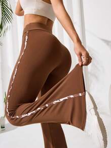 Easithlete Women Asymmetrical Waist Flared Sporty Pants - Brown - View 1