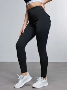 Damen Einfarbige Leggings mit Vordertasche und Bindedetail für den Lässig Outdoor Bereich