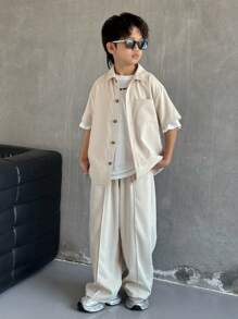 SHEIN Leap Crew 2pcs Tween Boy Casual Solid Color Collared Pocket Short Sleeve Shirt And Elastic Waist Pants Set, Suitable For Autumn, Spring, Summer, For Outdoor Play, School, Street, Party And Leisure - Khaki - View 1