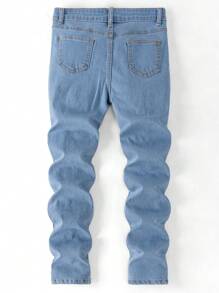 SHEIN Jeans de mezclilla negros y blancos para niños preadolescentes con efecto desgastado, rasgado y asimétrico, de tiro medio y silueta ajustada, para ropa de otoño de niños preadolescentes