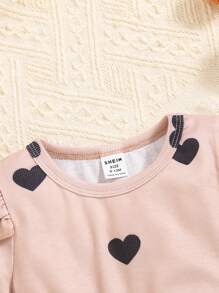 Baby/Toddler Girls Elegant Fashion Casual Versatile Loose Comfortable Rib Knit Heart Print Cap Sleeve Beige T-Shirt Top And Black PU Leather Ruffle Elastic Waist Skirt Infant OOTD Outfit, Spring/Summer New