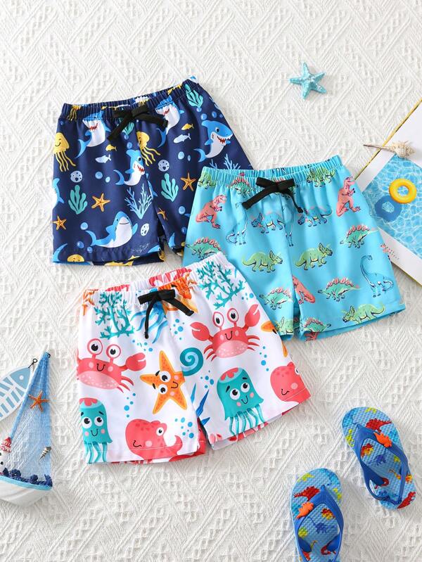 SHEIN 3 pièces/set Maillots de bain d'été décontractés pour bébé garçon, motifs dessin animé de dauphins, dinosaures et requins pour plage, océan, vacances. Pack de base pour extérieur, maison, plage, résort