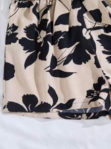 SHEIN Teenager Mädchen Schwarz Tank Top + Khaki Blätter Muster Loose Shorts 2-teiliger Anzug, Urlaubsstil geeignet für den Sommer