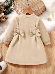 SHEIN Vestido corto informal para bebés con mangas largas, diseño de moño y color liso