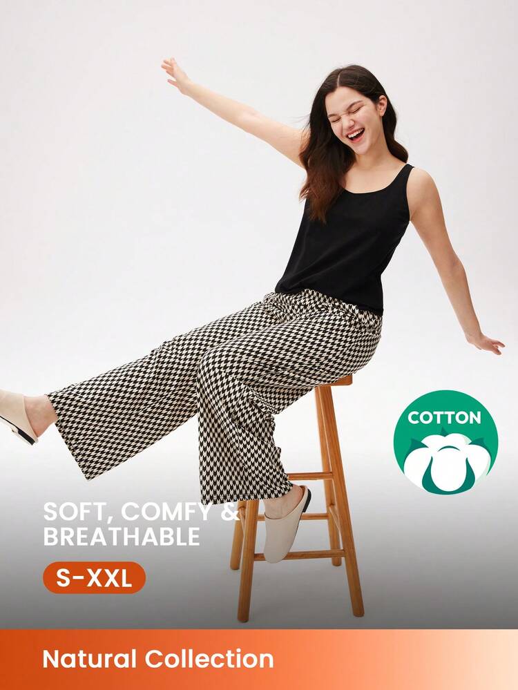 Set pigiama estivo da donna in cotone morbido, composto da canotta nera basic e pantaloni con fantasia. Pantaloni con tasche, adatto come abbigliamento da camera. Set pigiama in cotone a due pezzi, con pantaloncini capri, adatto per la primavera e l'estate.