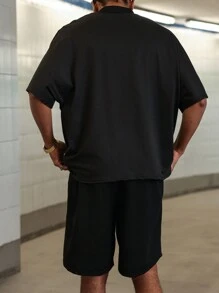 PAVTROS Manfinity Streetrush Men's Youthful Street Style, Featuring A High Street Niche With A Red Human Head Design. This Outfit Includes A Black Short-Sleeve T-Shirt And Shorts Set With Foam Print, Designed In A Relaxed Micro Stand-Up Collar And Slightly Batwing Sleeves. The Outfit Showcases A Black, Red, And Gold Color Contrast Design. It Makes An Excellent Gift Idea For Boyfriends Or Husbands, Embodying Streetwear With A Y2K Vibe ,Men Two Pieces Outfits ,Men Shorts Set Men Graphic Shorts Men Outfits Graphic Men Clothing Men T Shirt Co Ords - Black - View 2