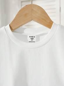 SHEIN 1 Pieza Camiseta para Niñas Jóvenes, Estilo Urbano Leisure, Cuello Redondo Manga Corta Camiseta Blanca, Cómoda y Versátil, Adecuada para Primavera y Verano. Esta Camiseta para Niñas es Adecuada para Diversas Ocasiones como Actividades al Aire Libre Urbanas, Deportes, Ocio en Casa, Escuela y Reuniones. - Blanco - Ver 5
