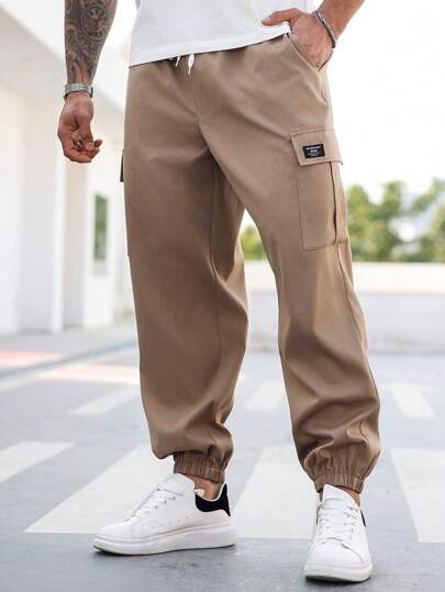 Manfinity Homme Pantalones cargo de talla grande para hombres con cintura con cordón y bolsillos laterales, para uso casual diario, otoño
