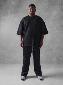 SUMWON Pantalon de survêtement ample avec éclaboussures de peinture, coupe évasée. Bas d'entraînement de mode urbaine, pantalon jogging tout saison. Tenue décontractée pour l'athléisme