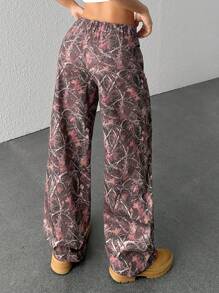 SHEIN EZwear Pantalones casuales con botones delanteros y estampado all-over para mujeres