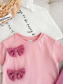 Conjunto de 2 piezas para bebé niña con blusa de manga corta y lazo rosa, y pantalones para verano