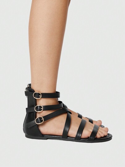 Goth Sandalias romanas casuales de mujer con múltiples correas entrecruzadas y acento de hebilla metálica, punta redondeada, planas de PU negro aptas para el uso diario, compras y caminatas