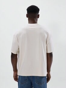 Musero Camiseta de manga corta con cuello redondo, hombros caídos y gran estampado gráfico con el lema "ART CLASS", una prenda esencial para la y el verano - Albaricoque - Ver 3